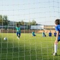 Young people playing football