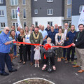 New residents Doug and Judy Hodges officially declare the Quintrell Downs development open alongside Mayor of Newquay Cllr Drew Creek and others.