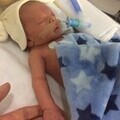 Lewis tragically passed away at just four days old