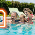 Image of a family using a mobile phone on holiday powered by an eSIM from easySim.global