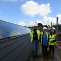 Coastline’s Ben Nevitte escorts Hayleigh Harris, Extra Care Manager at Miners Court, and Ellie Johns, Deputy Manager, around the new PV panels.