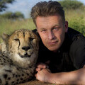 Photo of Chris Packham with Cheetah taken at Okonjima, Namibia - home of the AfriCat Foundation