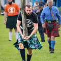 Heavyweights competitor tossing the caber at Stirling 2023