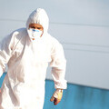 Asbestos- person in protective clothing