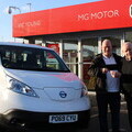 Brian Marnie receiving the keys to his electric taxi