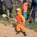A young child gets ready to join in the tree planting.