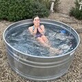 Freya taking a plunge in a cold water tank in her garden