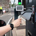 A driver stops at the Clifton Suspension Bridge toll barriers. (c) Lee Pullen for Clifton Suspension Bridge