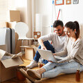 young couple unpacking boxes