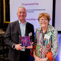 Viven Jones and Tim Cuddeford with their award.