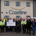 Colleagues at Coastline Housing gather to hand over their £20,000 to representatives and riders from Cornwall Blood Bikes. 