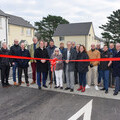 New resident Carol Smale does the honours of officially cutting the ribbon to mark the St Columb development open