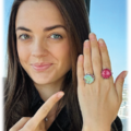 Woman pointing at her new tomee ring