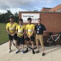 Michael, Daniel and Callum outside Scott House at the end of their cycle.