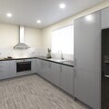 Newly fitted, contemporary kitchen with essential appliances.
