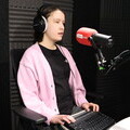 Image of Ellie Wallwork recording the announcement of the winners of the Calibre Audio Awards using her Braille reader.