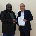  Joshua Tauko, Secretary for Treasury and Finance, ABG (left), and Aldo Sagastume, FreeBalance’s Vice President for PFM