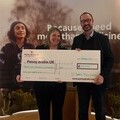 Tony Anderson, representing St James’s Place Foundation presents Laura Kerby, Chief Executive at Penny Brohn UK with the donation 