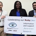 Marsha De Cordova MP with Nystagmus Network trustees Harshal Kubavat and Peter Greenwood.