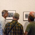 Visitors viewing historical photographs on the APHEUM Frames at the exhibition opening in Schwalmtal town hall. Photo: Municipality of Schwalmtal.
