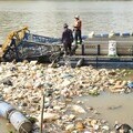 A waste collection vessel operated by everwave that collects plastic and debris from a river in Cambodia