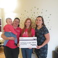 01. Sophie and her family went to Chestnut House to present the cheque. L-R Sophie, House Manager Abi, Hannah and Rachel