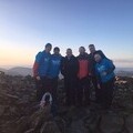 Christian Smith and friends at the peak of Scafell Pike in the Lake District National Park