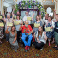 volunteers with Coastline Housing proudly celebrate their combined achievements this year