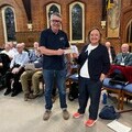 Choir Chairman, Mark Kusionowicz, presents a cheque to Lynda Landauer from the Cheryl King Trust 