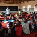 Pupils from Ngambenyi Primary School at lunchtime in their school dining hall.