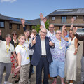 Completion celebrations! Residents and volunteers from Miners Court gather with staff to mark the completion of the solar panel project.