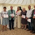 Image of the seven volunteers being presented with 5 year service awards by Karen Napier and Richard Balkwill, Calibre Chair of Trustees