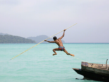 Image: Moken man spear fishing in the Andaman Sea. Photographer - Cat Vinton, UK. Important: use of this image is strictly restricted to news items or articles about the TPOTY exhibition or awards. 