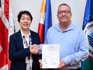 PEZA official signing Maria Veronica F. Magsino (Deputy Director General for Policy and Planning) and Jason Tyas (President of Expromet Asia Inc)