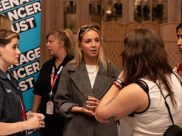 Eden Taylor-Draper meets young people supported by Teenage Cancer Trust at an event