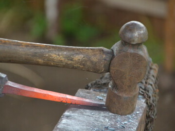 Blacksmiths Hammer on Anvil