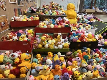 Crates of knitted Easter chicks at Francis House Children