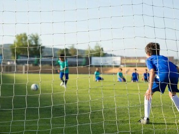 Young people playing football