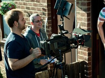 Producer far left - Andrew Dobosz, and Kevin Healey filming on set