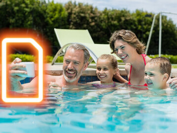 Image of a family using a mobile phone on holiday powered by an eSIM from easySim.global