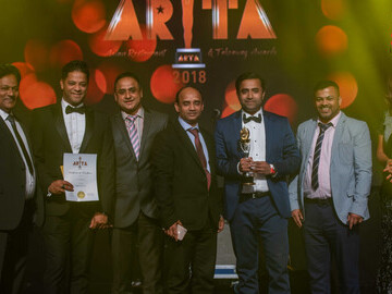 Cam Spice receiving ARTA Award 