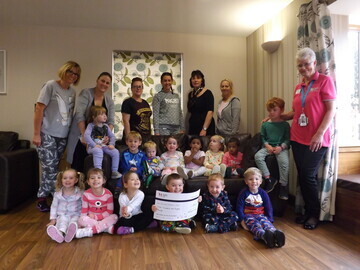 Children from Free Spirits Nursery presented the cheque to The Sick Children