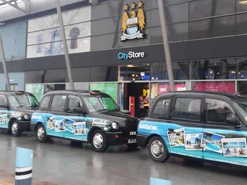 Superside cabs outside the Manchester City store