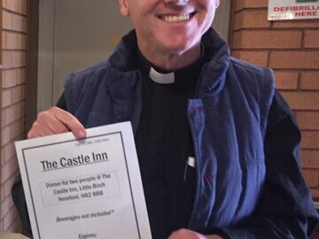 Local vicar Mark Johnson with his raffle prize winning