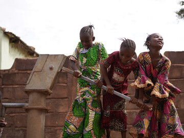 Girls at a borehole in Mabvuku, Harare, Zimbabwe