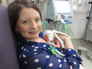 02. First cuddle with Mum Suzanne at six weeks old on Boxing Day. The first time Amelia was well enough to be out of the incubator.