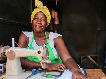 Harriet, a tailor from Uganda who was able to pay her children