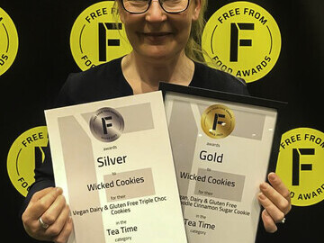 Business owner Sally Rees with the two Free From Food Award certificates