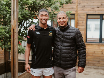 Henwhill with his rugby coach Mr Bronwyn May