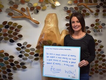 4) Michelle Macrae with ‘I play Your Hospice Lottery because…’ sign 